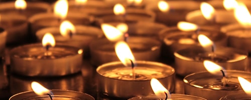 Lit Memorial Tealight Candles