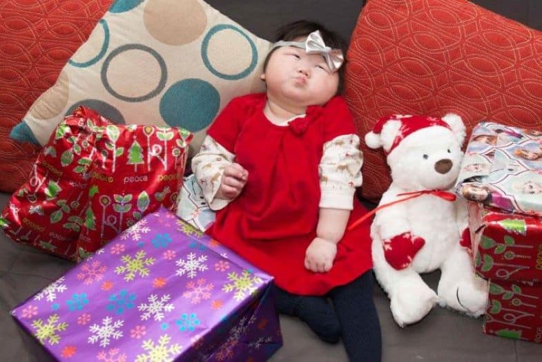 Little Girl Sitting Around Presents