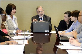 Doctor and Colleagues around a table