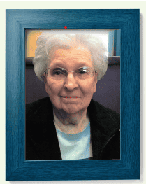 Woman Smiling in blue picture frame