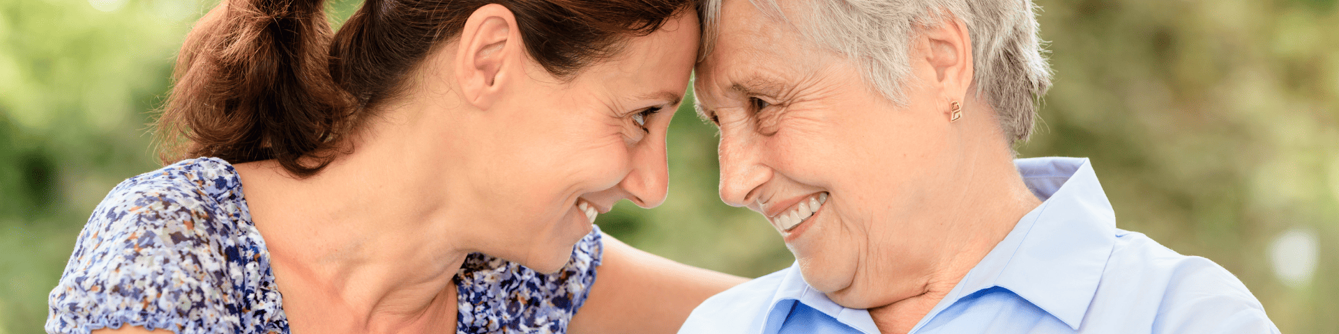 mother and and daughter smiling at each other